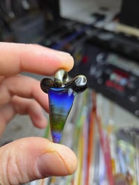 Image 4 of Electrum/amber purple glass shark tooth pendant. 