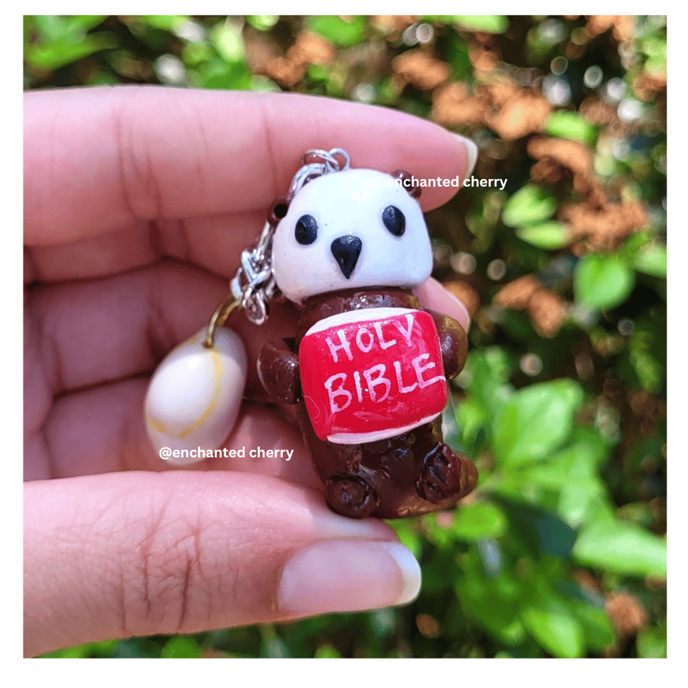Image of Northern Sea Otter Holding Bible Keychain