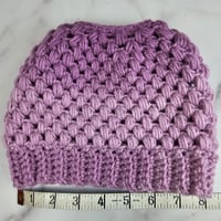 Image 4 of purple ponytail crocheted hat
