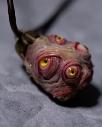 Image 11 of Egg of the King pendant, leather cord, brass hardware, all seeing glowing eyes