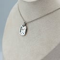 Enamel and sapphire tag 