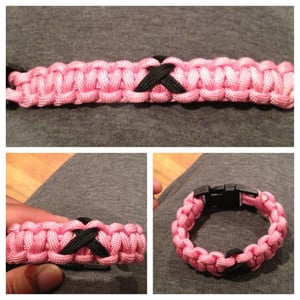Image of Pink Paracord Bracelet with Solitary Black Breast Cancer Ribbon