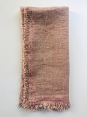Image of ruby pale orange linen towel with pink stitching