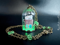 Image 9 of Uranium Handbook For The Recently Deceased Glass Dome Neckalce With Wooden Hanger