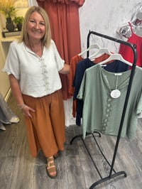 Image 1 of Dani - Textured  Blouse with Floral Button Detail