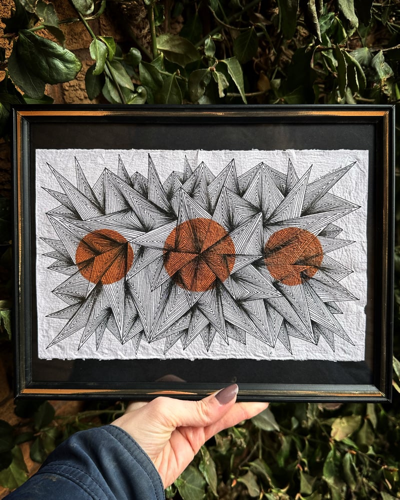 Image of Sunlight Burst on handmade paper, displayed in vintage frame