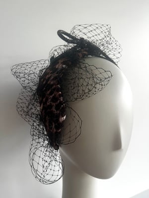 Image of Leopard fabric covered headpiece