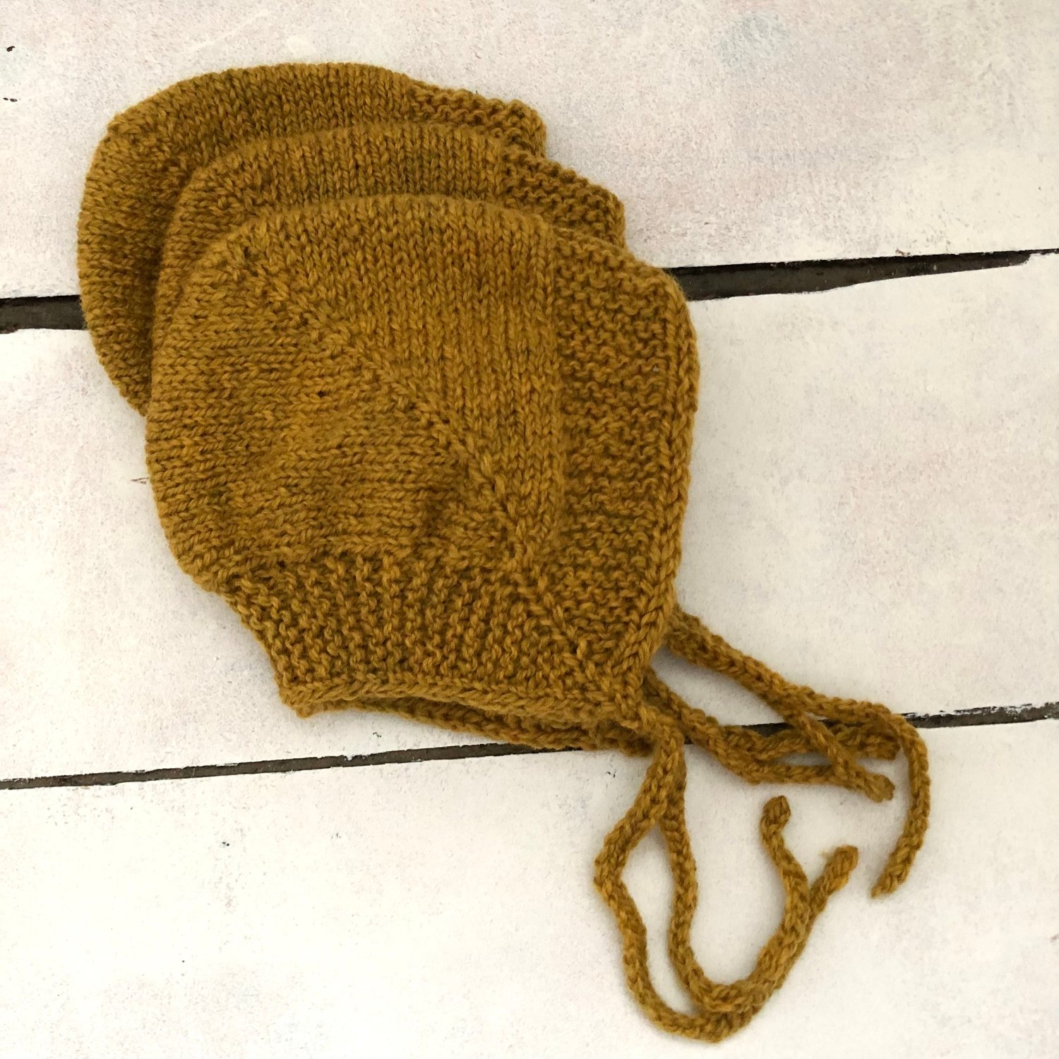 Image of Handknit Baby Bonnet - Rust