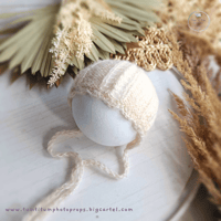 Knitted newborn bonnet light beige