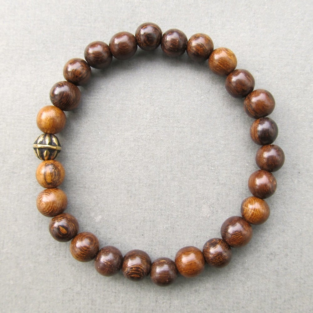 Image of Brown robles beaded stretch bracelet with antique gold bead