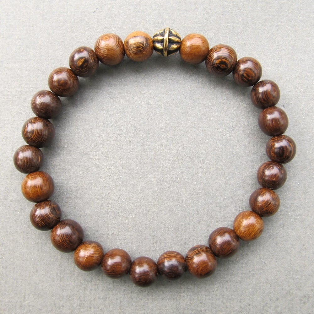 Image of Brown robles beaded stretch bracelet with antique gold bead