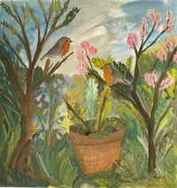 Image 1 of Two robins in a spring wild garden