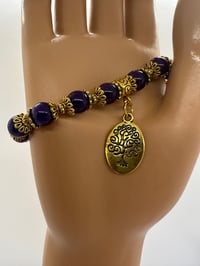 Image 1 of Purple and gold tone bracelet 