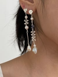 Image 3 of violet skull earrings