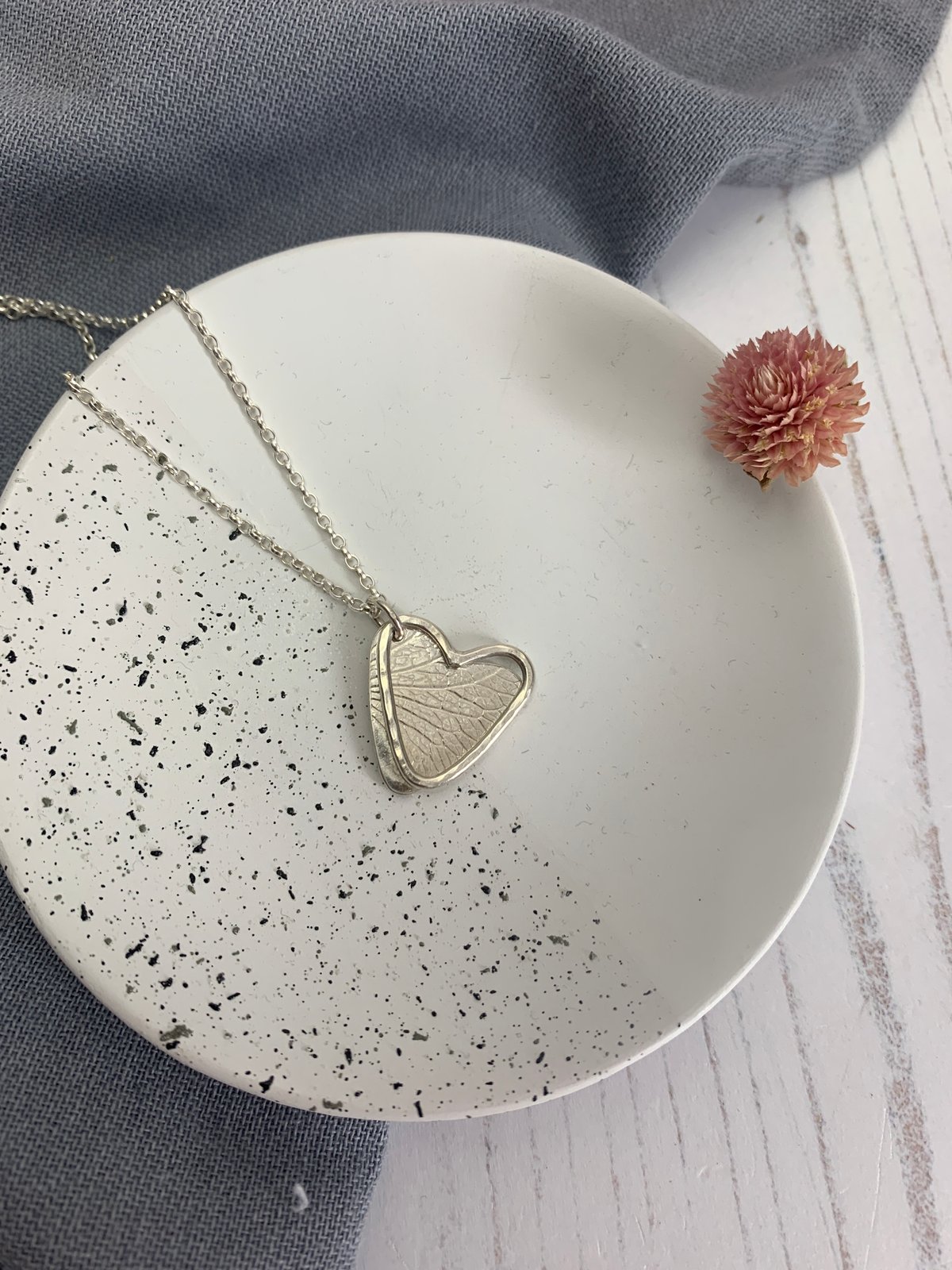Image of Two hearts petal imprint necklace, handmade with recycled sterling silver. 