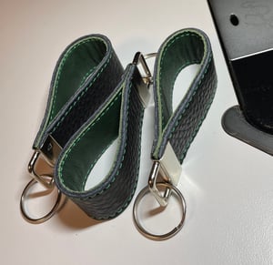 Image of Black and green key chain 