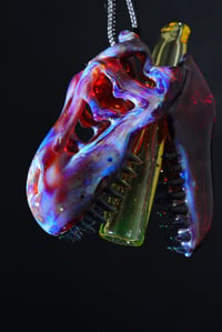 Image 1 of Opalized amber purple T-Rex skull pendant with illuminati joint tip