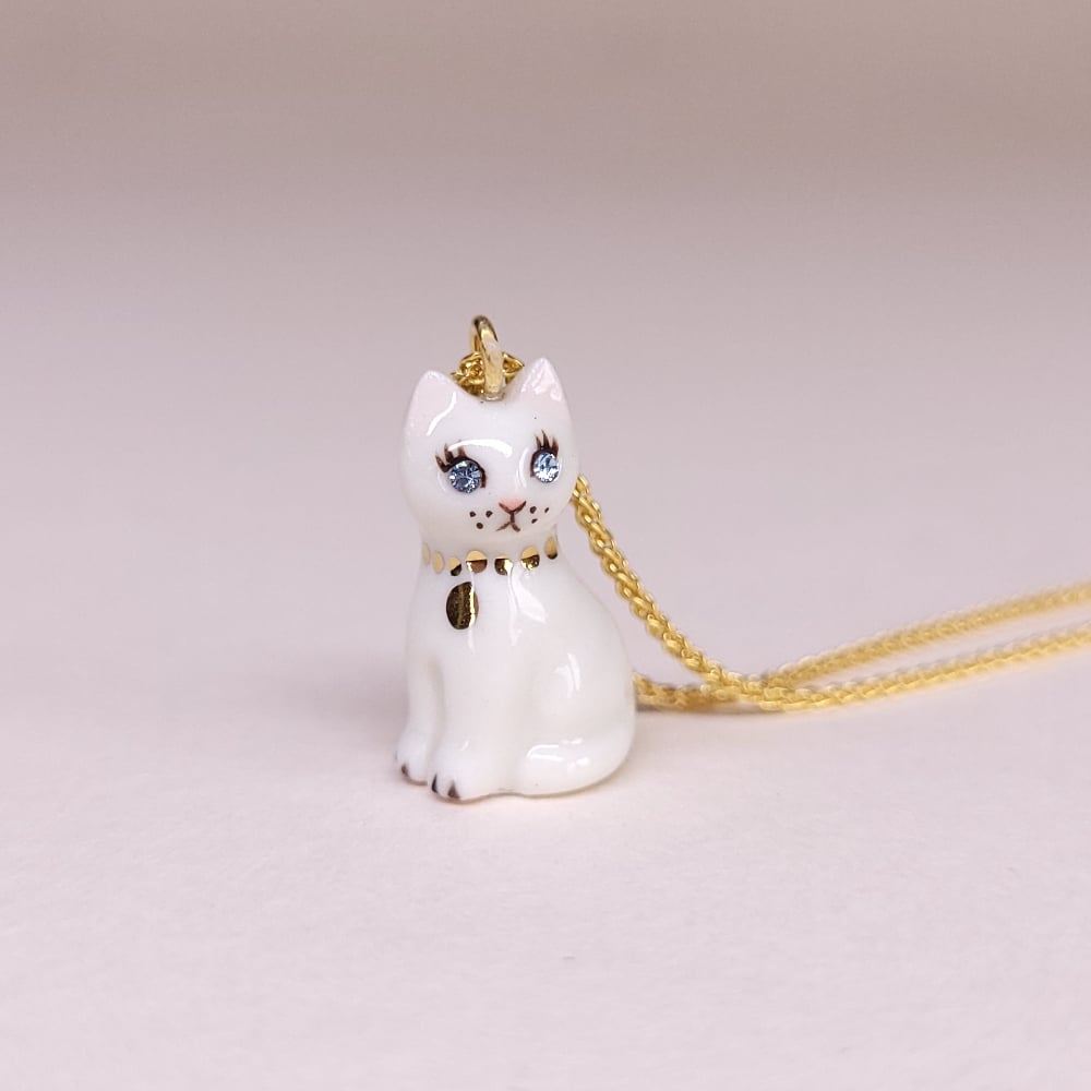Image of White Porcelain & Gold Vermeil Sitting Kitten Pendant