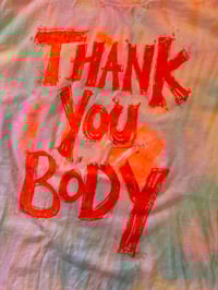 Image 1 of Rainbow multi colour tie dye t shirt with fluro orange uv active text (large)