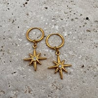 Image 1 of Compass Huggie Earrings