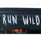 Image of Run Wild White Vinyl Decal Size 10" x 2.5"