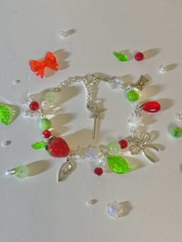 Image 1 of cluttered strawberry bracelet