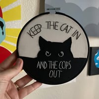 Cats in, Cops out