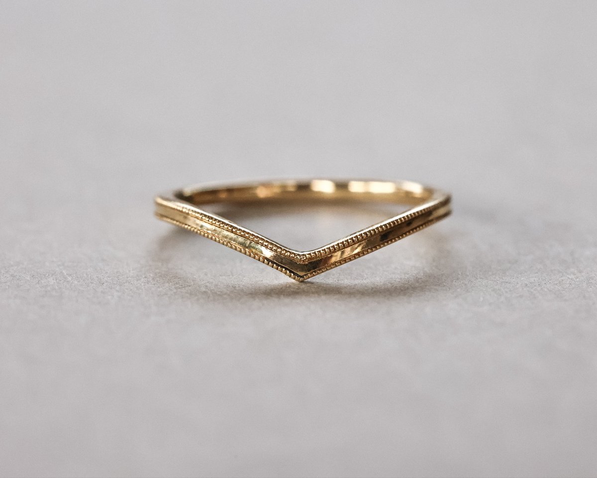 Image of 18ct yellow gold 1.5mm milled edge wishbone ring