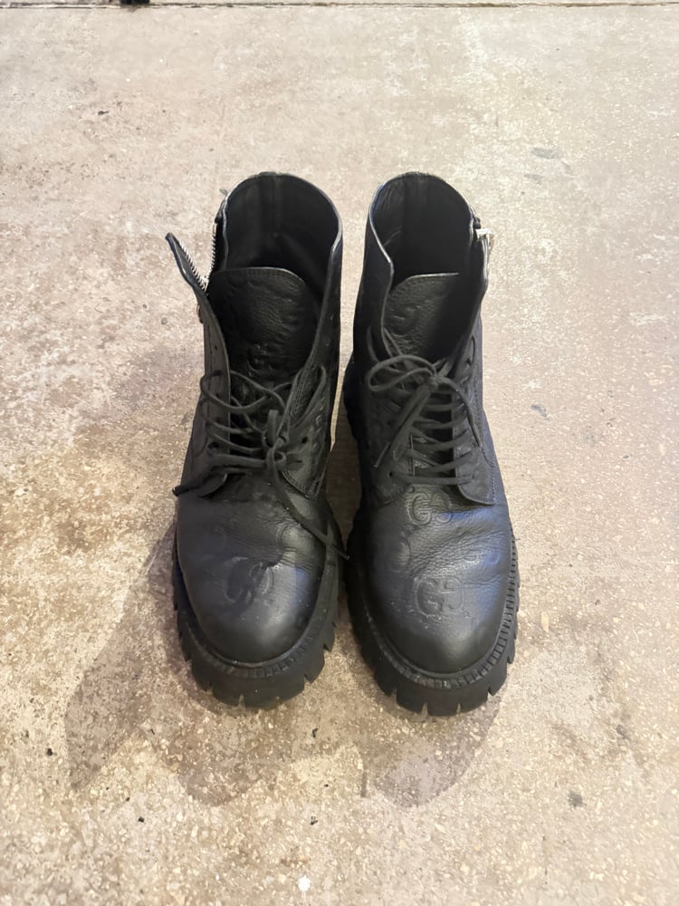 Image of Gucci Monogram Debossed Lug Boots