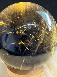 Image 14 of Golden Rutile In Smoky Quartz Sphere #1769