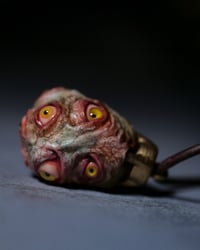 Image 10 of Egg of the King pendant, leather cord, brass hardware, all seeing glowing eyes