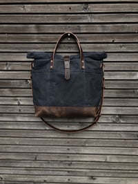 Image 6 of Black waxed canvas roll to close top tote bag with luggage handle attachment 