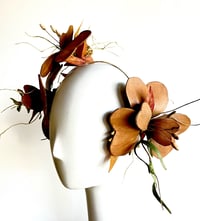Image 2 of Tan bilateral flower headpiece. 