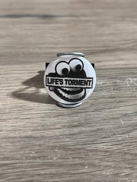 Image 2 of Life’s Torment 1.25” Button