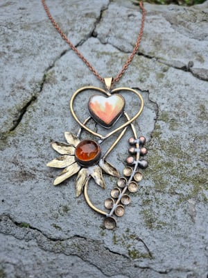 Heart pendant with orange flower