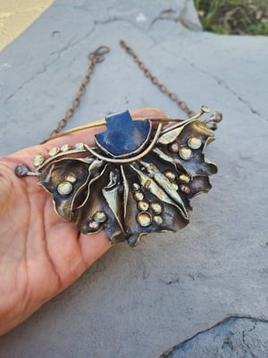 Blue stone and bullet cussings necklace 