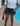 Black ruffled denim shorts
