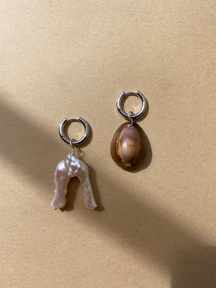 Image of Mismatched cowry earrings - silver 