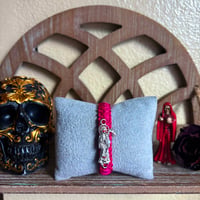 Image 1 of Red Eyed Santa Muerte Magenta Bracelet 
