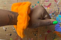 Image 1 of orange fluff