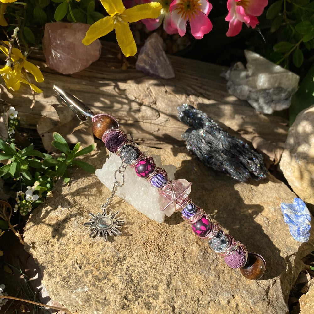 Image of magenta sun roach clip