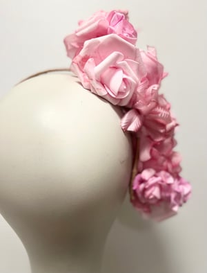 Image of Soft pink flower headpiece. 