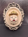 Rosy Cheeked Gold Crowned Framed Face