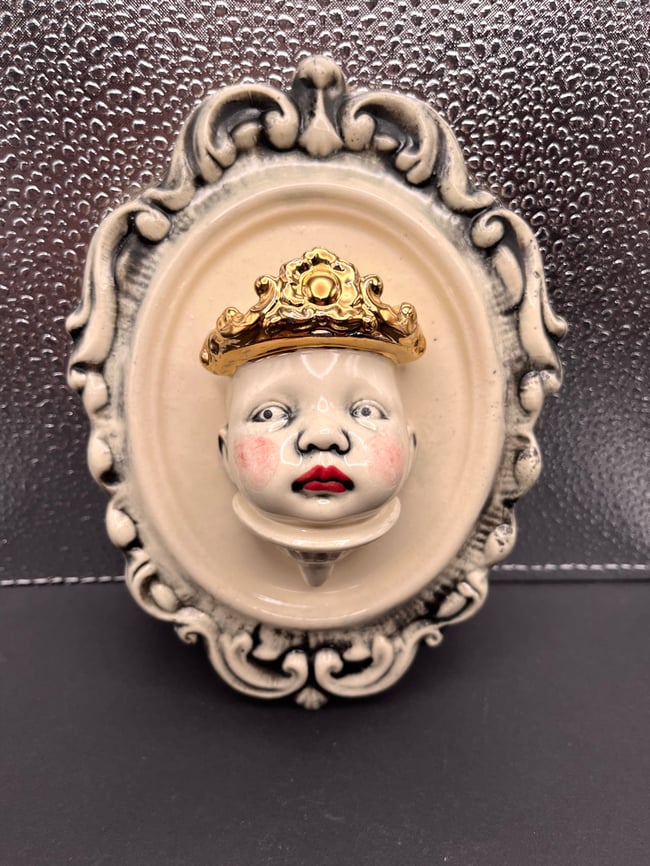 Rosy Cheeked Gold Crowned Framed Face