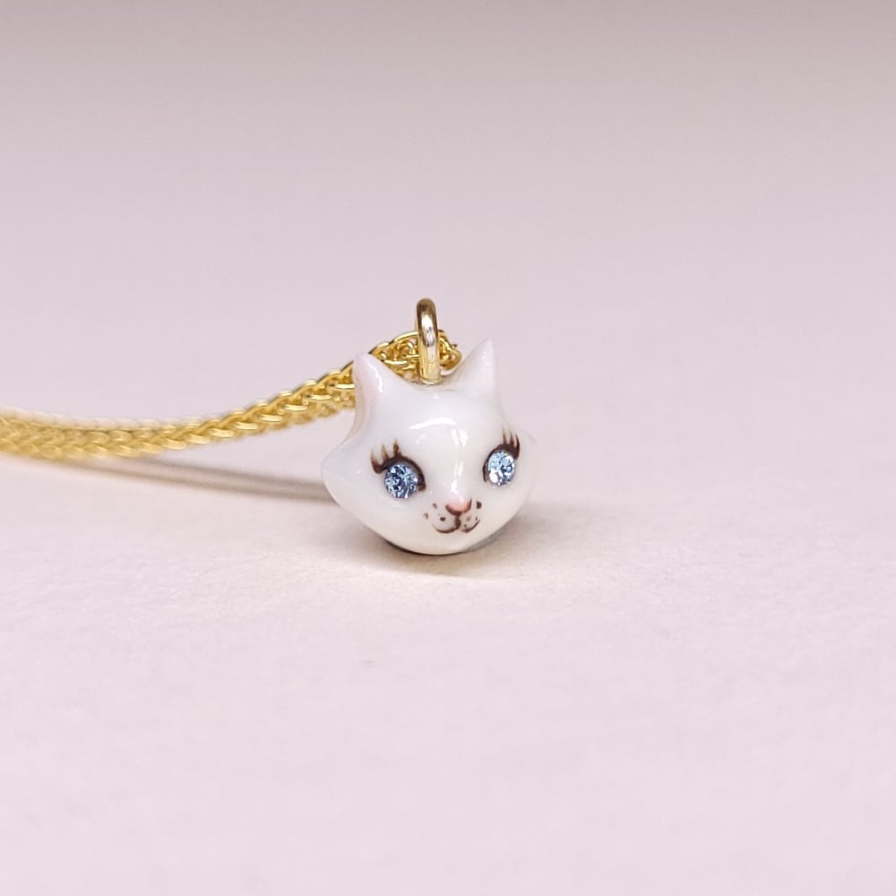 Image of White Porcelain & Gold Vermeil Teeny Tiny Cat Pendant