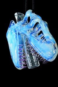 Image 2 of Glopal (uv reactive) T-Rex skull pendant with dichro tip and crushed opal teeth. 