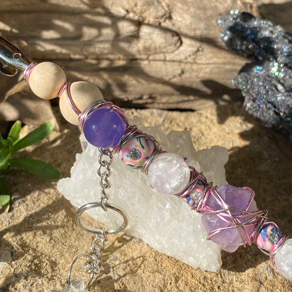 Image of magenta sun roach clip