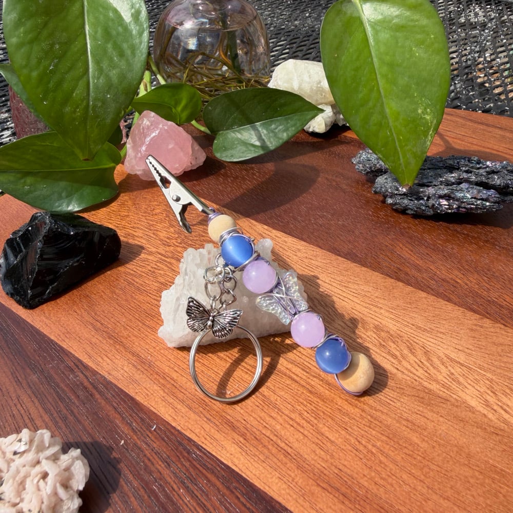Image of indigo monarch clip keychain