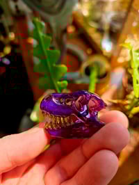 Image 3 of Royal jelly mini T-Rex skull pendant with uv reactive teeth 💜 