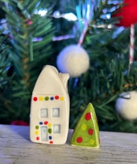 Image 3 of Big House with lights and a Christmas Tree